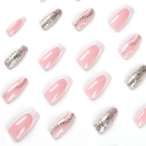 French tip press-on nails with silver glitter, pink lines, and rhinestone accents in coffin shape