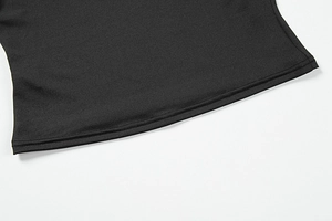 Detail of double-needle hem stitching on black slim-fit off-shoulder top for women