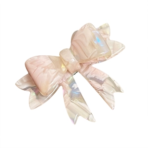 Pink marble texture acetate bow hair clip with shimmering shell finish and iridescent glow