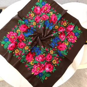 Detailed pattern of Russian style floral prints on a dark brown cotton linen scarf