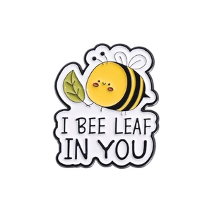 Cute cartoon bee enamel pin with I BEE LEAF IN YOU pun quote for clothes and bags
