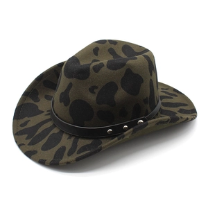 Close-up of green wool cowboy hat with cow pattern and studded leather band detail
