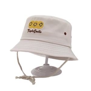 Kids beige canvas bucket hat featuring yellow triple smile embroidery and chin strap