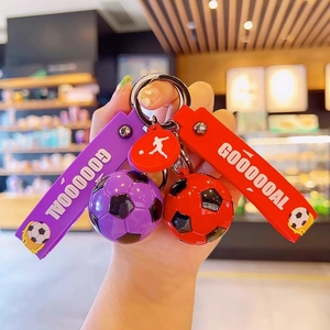 Creative soccer doll keychains in red and purple with silicone straps and goal pendants