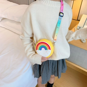 Yellow round silicone kids crossbody bag featuring rainbow and colorful wide strap