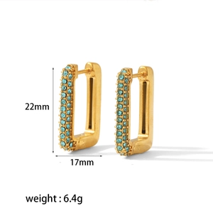 Detail showing 22mm x 17mm gold rectangular earrings with blue zircon micro-paving