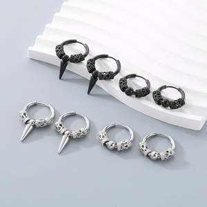 Set of 8 spike and ball hoop earrings in black and silver on wave display