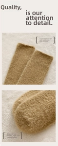 Detail of brown plush socks featuring elastic cuffs and smooth toe stitching for comfort
