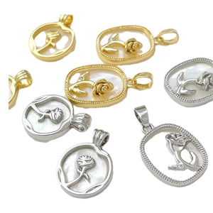 18k gold plated rose relief pendants in gold and silver finishes on white background