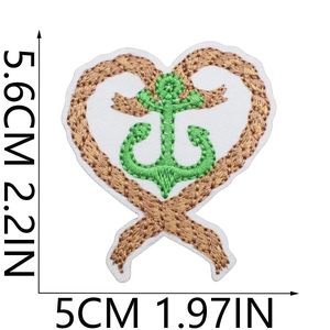 Detail showing embroidered anchor and rope heart patch with precise measurements 5.6x5cm