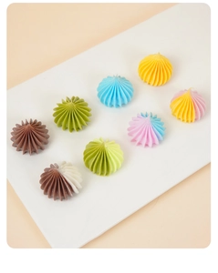 Detailed view of colorful miniature ribbed resin beads for DIY dollhouse crafts and projects
