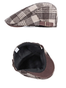 Detailed view of checkered ivy cap showing cotton polyester fabric and side buckle
