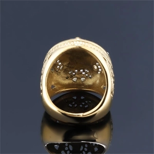Golden stainless steel star ring with intricate hollow texture and gemstone settings