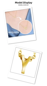 Macro detail of polished gold-plated 26 letters pendant and necklace chain for women