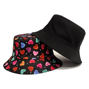 Women's sun protection bucket hat set in solid black and colorful heart pattern