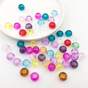 Macro view of colorful mixed transparent round acrylic beads for DIY jewelry making