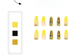 Detailed view of yellow French tip press-on nails with butterfly motifs and rhinestones