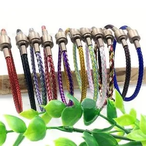 Detailed display of colorful braided leather bracelets with gold screw clasps on wood