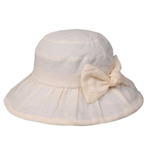 Elegant wide brim linen sun hat for women with a large bow decoration in cream white color