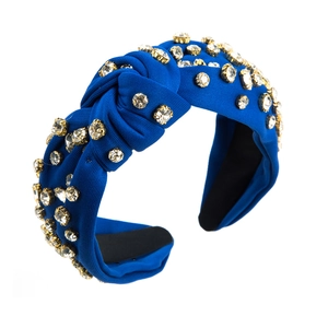Baroque style royal blue knotted headband with sparkling crystals and gold claw settings