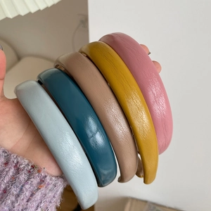 Multi-colored thick faux leather headbands for women in five pastel candy colors