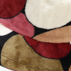 Macro shot of colorful geometric pattern on soft plush coral fleece bucket hat material