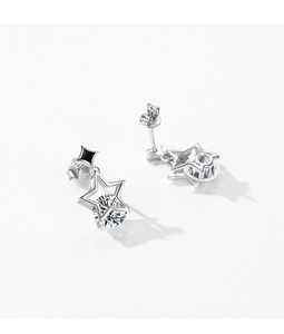 Macro shot of silver hollow star stud earrings with sparkling round clear zircons