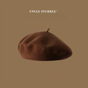 Detailed texture of high-quality dark brown wool beret with retro vintage design