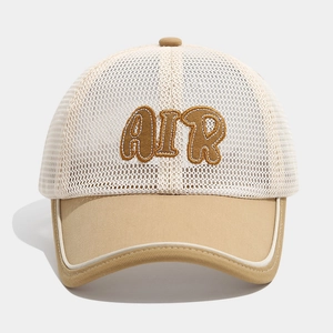 Detail of AIR puff embroidery on beige and white mesh trucker cap for boys