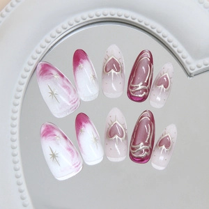 Pink and white gradient press-on nails with silver metal heart and 3D fluid line patterns