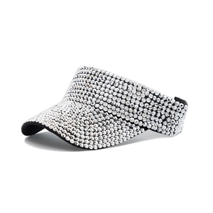 Close-up of sparkling silver rhinestones on a stylish women's sun visor hat