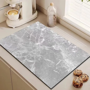Kitchen counter mat with gray marble pattern used under a coffee machine as a drying pad