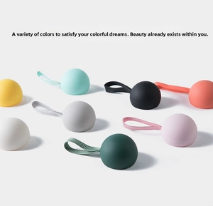 Detailed view of eight colorful silicone capsules with matching braided lanyards in rows