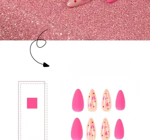 Macro detail of almond press-on nails with matte rose pink and heart patterns
