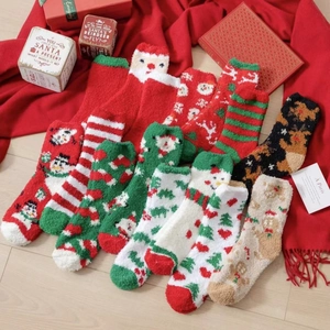 Thick Christmas coral fleece socks featuring festive patterns on warm festive background