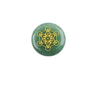 Green aventurine stone featuring a golden Metatron's cube sacred geometry engraving