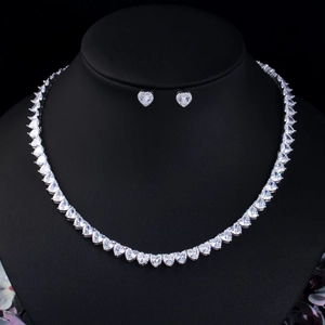 Elegant silver heart-shaped zircon necklace and stud earrings jewelry set display