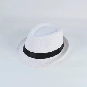 Detail of white woven paper straw fedora hat featuring breathable mesh texture and black band