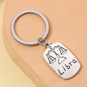 Detailed close-up of a Libra constellation alloy keychain with engraved zodiac sign pattern