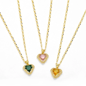 Golden heart pendant necklaces with green, pink, and yellow zircons on white background