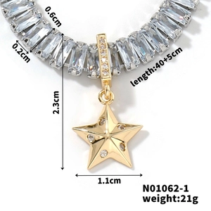 Macro shot of gold star pendant with clear rectangular crystals on a dainty chain