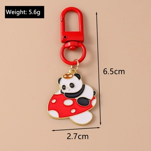 Detailed macro view showing the size and weight dimensions of the enamel panda keychain