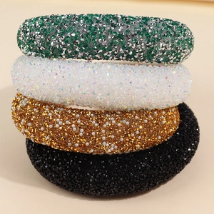 Sparkling padded headband with rhinestones and pearls in green, white, gold, and black