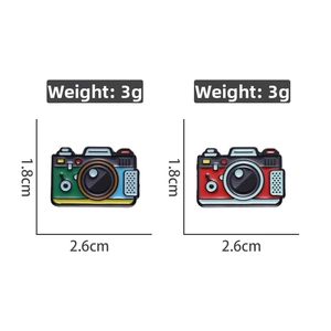Detailed view of enamel camera pins with dimensions 2.6cm x 1.8cm and 3g weight
