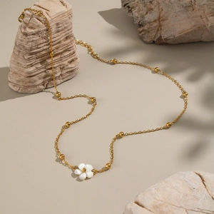 Minimalist 18K gold plated stainless steel necklace with white shell flower pendant on stone