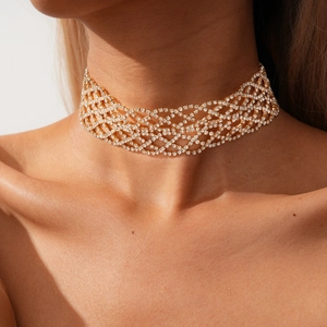 Detailed view of the gold mesh choker with sparkling rhinestones on model neck