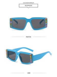 Detail view of sky blue square sunglasses with vertical colorful rhinestone embellishments