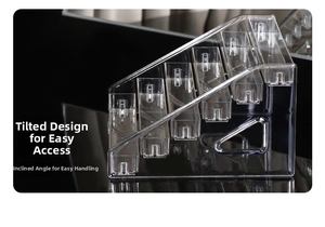 Close-up of clear acrylic tiered shelf organizer showing tilted multi-slot storage compartments