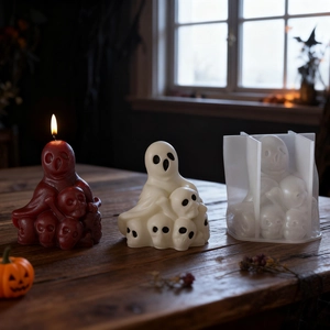 Detailed view of Halloween ghost and skull silicone mold with finished wax candles