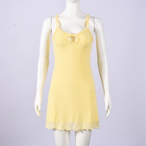 Detail of light yellow sundress featuring hollow ring cutout and ruffle strap neckline
